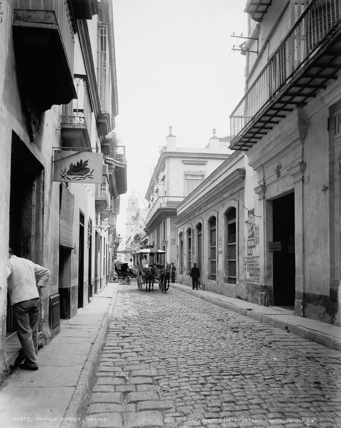 #17 A view from O’Reilly Street, looking down San Ignacio Street toward the Cathedral, Havana, 1900