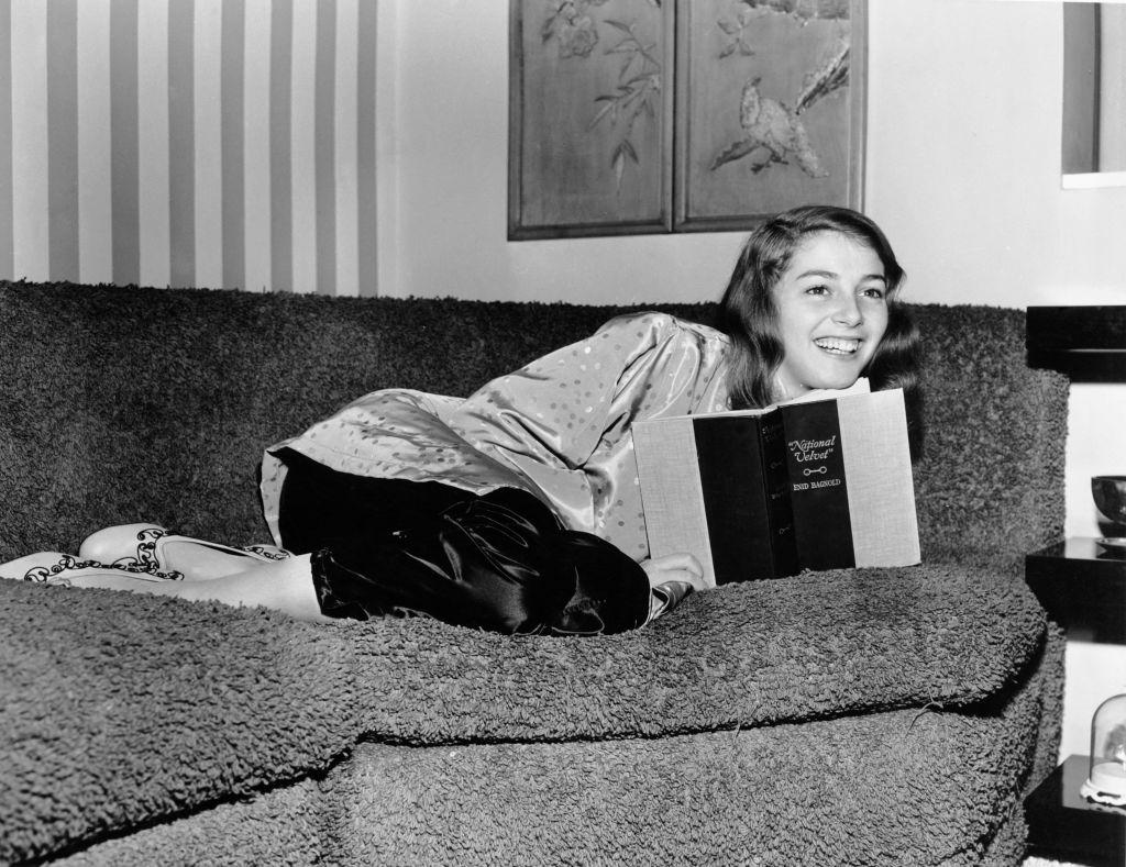 Pier Angeli reading a copy of the book ‘National Velvet’ by Enid Bagnold, circa 1950