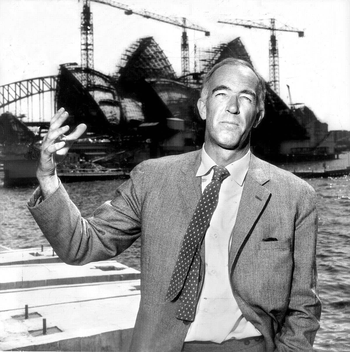 #16 Architect Jørn Utzon in front of the Sydney Opera House, eight years after his designed was selected and six years into construction, 1965