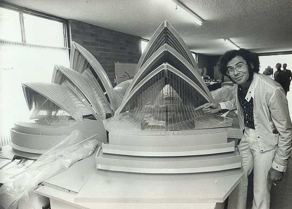 #27 Mr R.Consigli, one of many architects consulting on the building of the Sydney Opera House, is pictured with a model showing the main halls of the Opera House as it will stand in its finished state, December 1969.