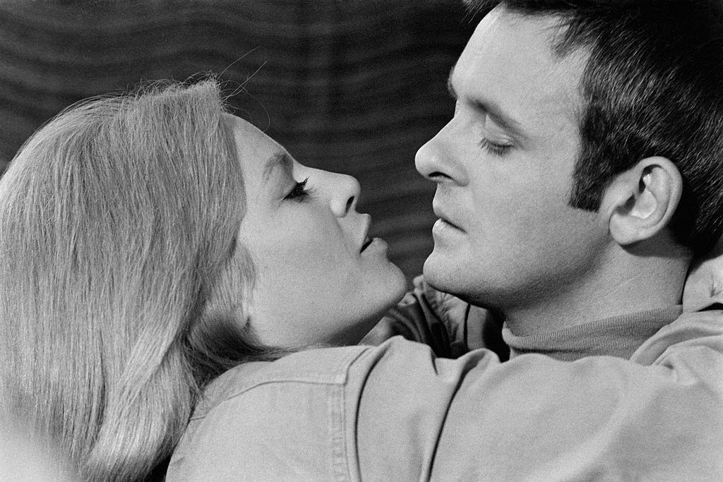 #42 Anthony Hopkins with actress Nathalie Delon on the set of ‘ When Eight Bells Tol’, 1969