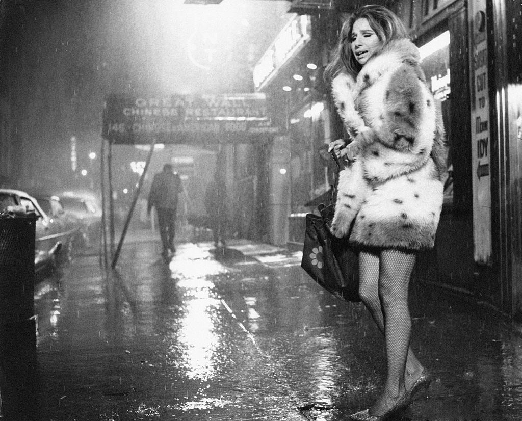 #6 Barbra Streisand,on the street under a violent rain. USA, 1972.