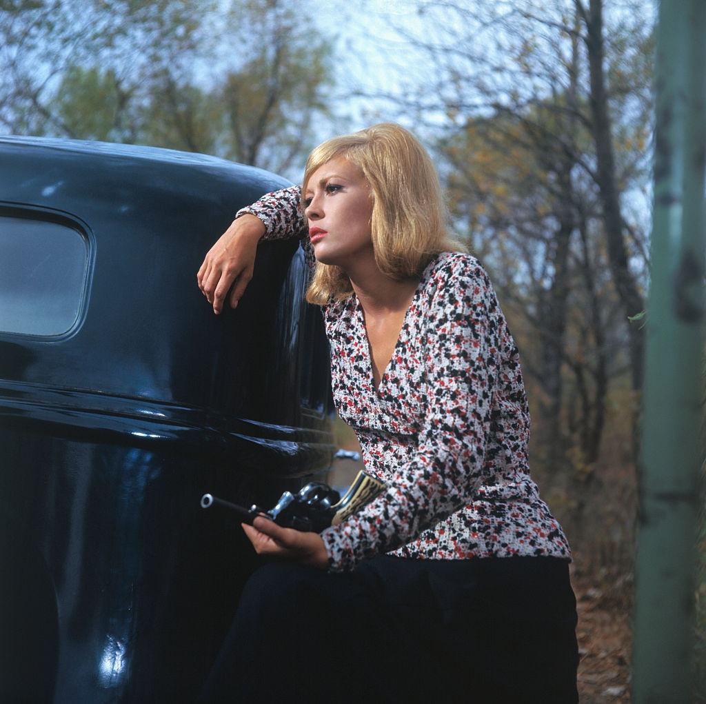 #32 Faye Dunaway holding a revolver, 1967