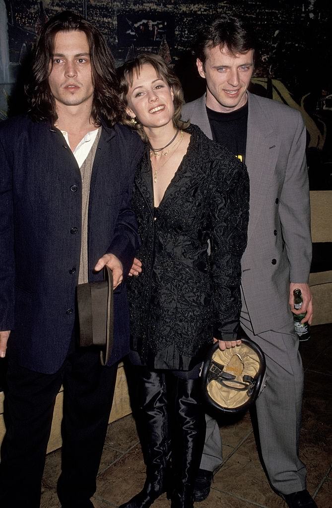 #37 Johnny Depp with Mary Stuart Masterson and Aidan Quinn at the Planet Hollywood in New York City, 1993