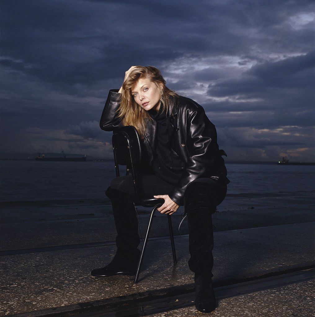 #10 Michelle Pfeiffer posing by a beach in Portugal at dusk, 1990