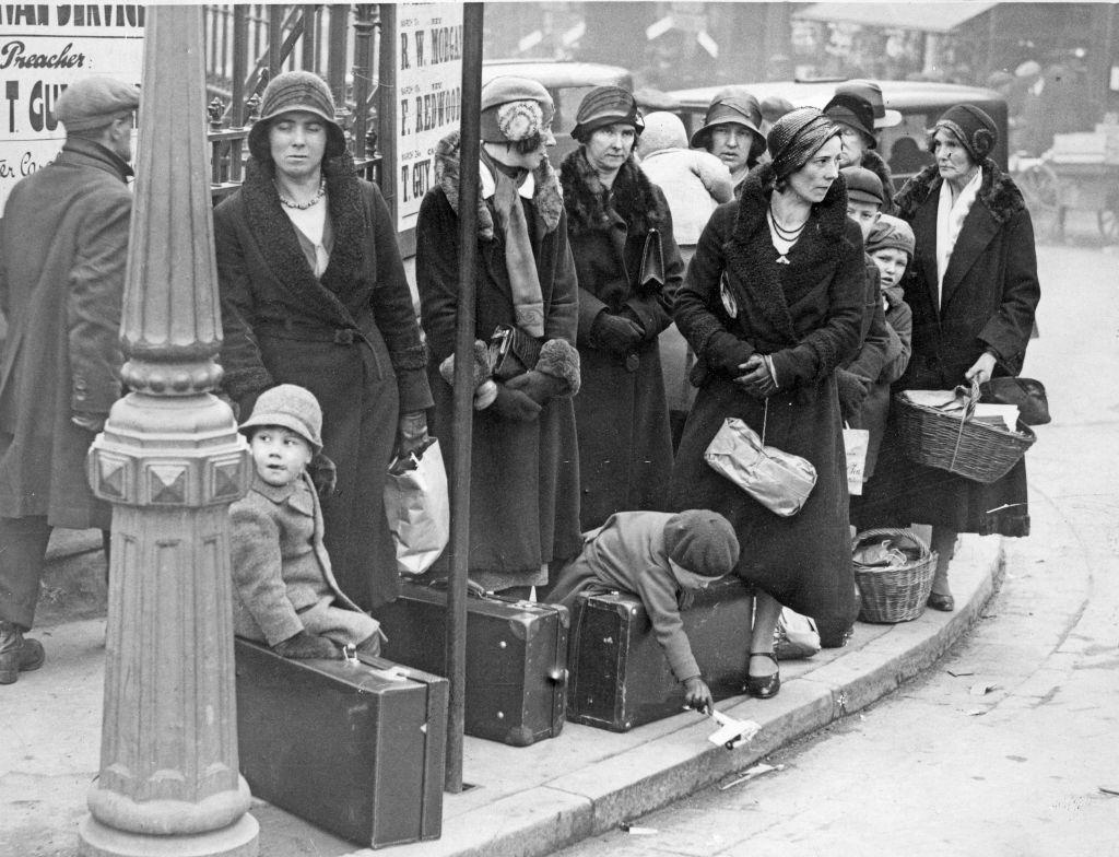 #11 Ladies with their young charges await the bus to take them on their holidays at Easter, 27th March 1932.