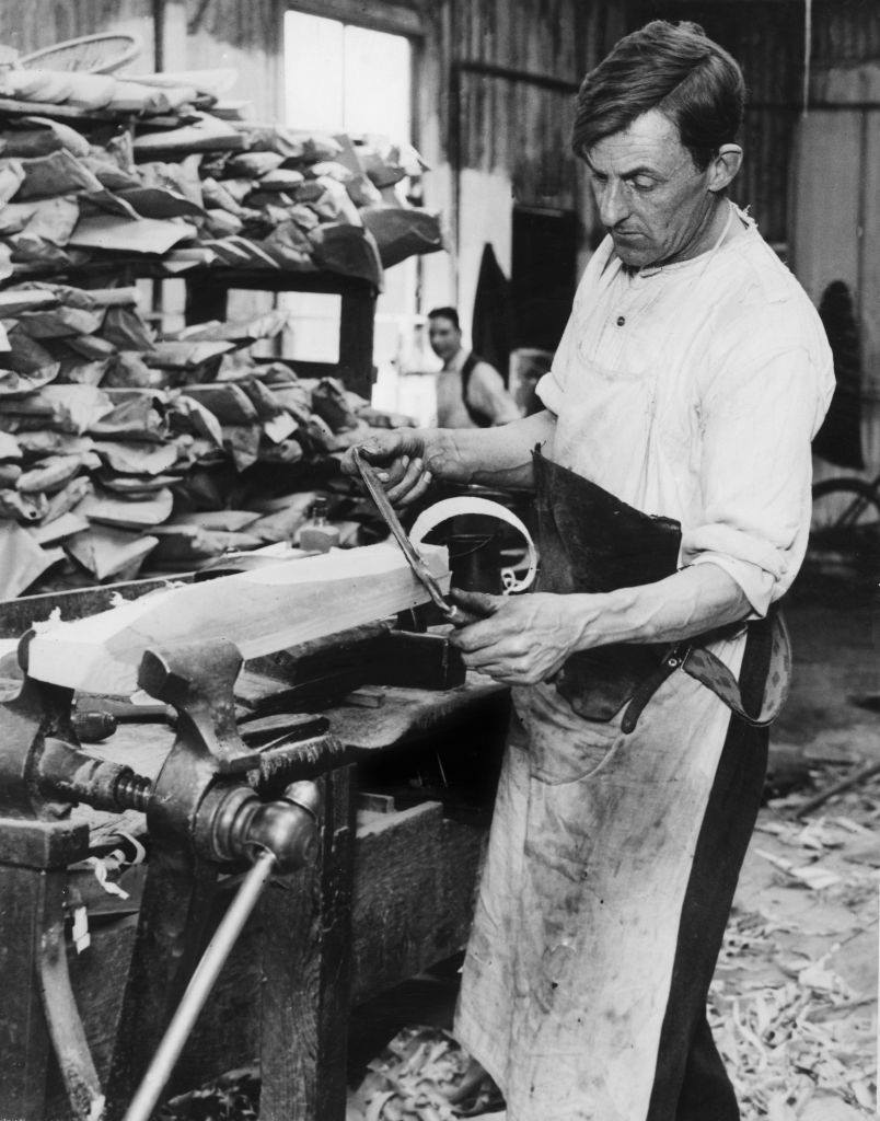 #7 A craftsman making a cricket bat in a Midland sports manufacturers factory, 1932.