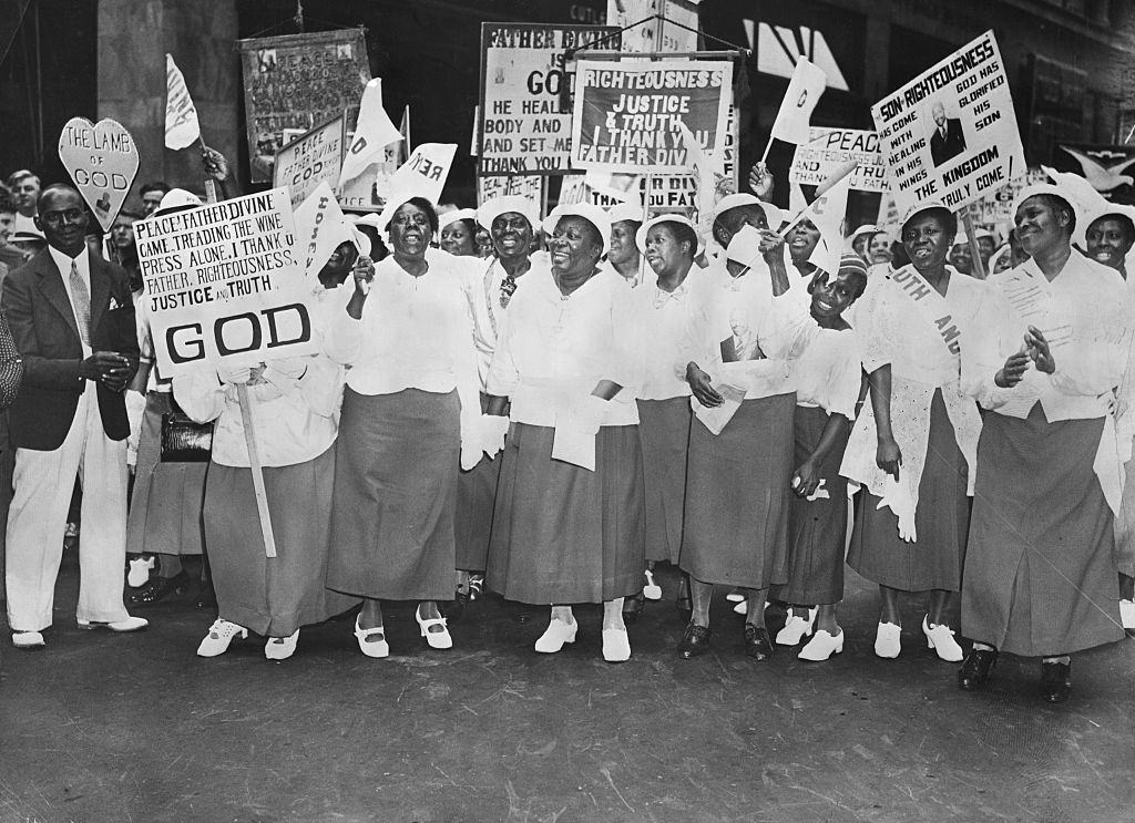 #53 A Harlem woman in a Father Divine parade, New York City, 1930s.