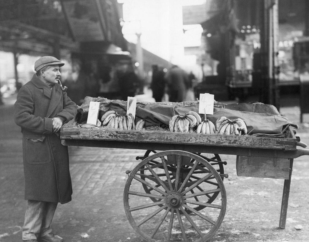 #36 Pushcart peddler selling bananas, NYC, 1930s.