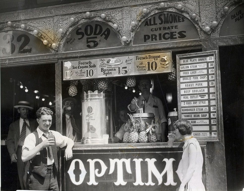 #37 Typical New York luncheonette selling fruit drinks in the 1930s.