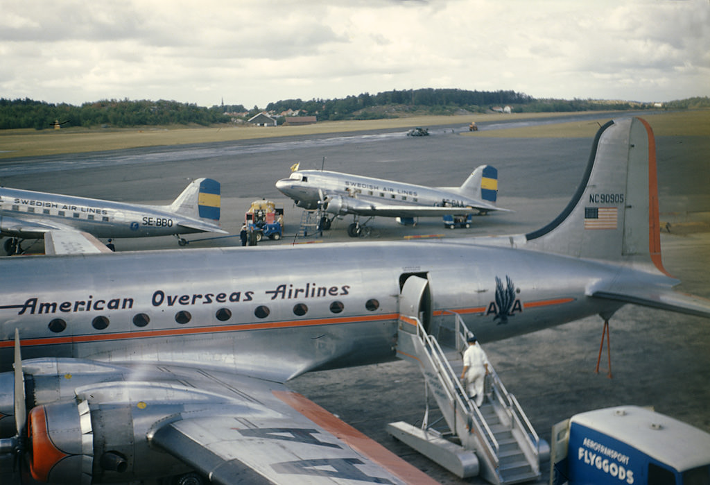 #21 Aircraft at Bromma Airport near Stockholm City. The aeroplane in the foreground is a Douglas DC-4, the two in the background are Douglas DC-3’s, 1947