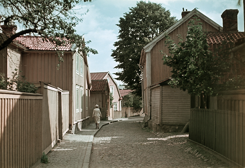 #51 A woman walking in Västerlånggatan street, 1945