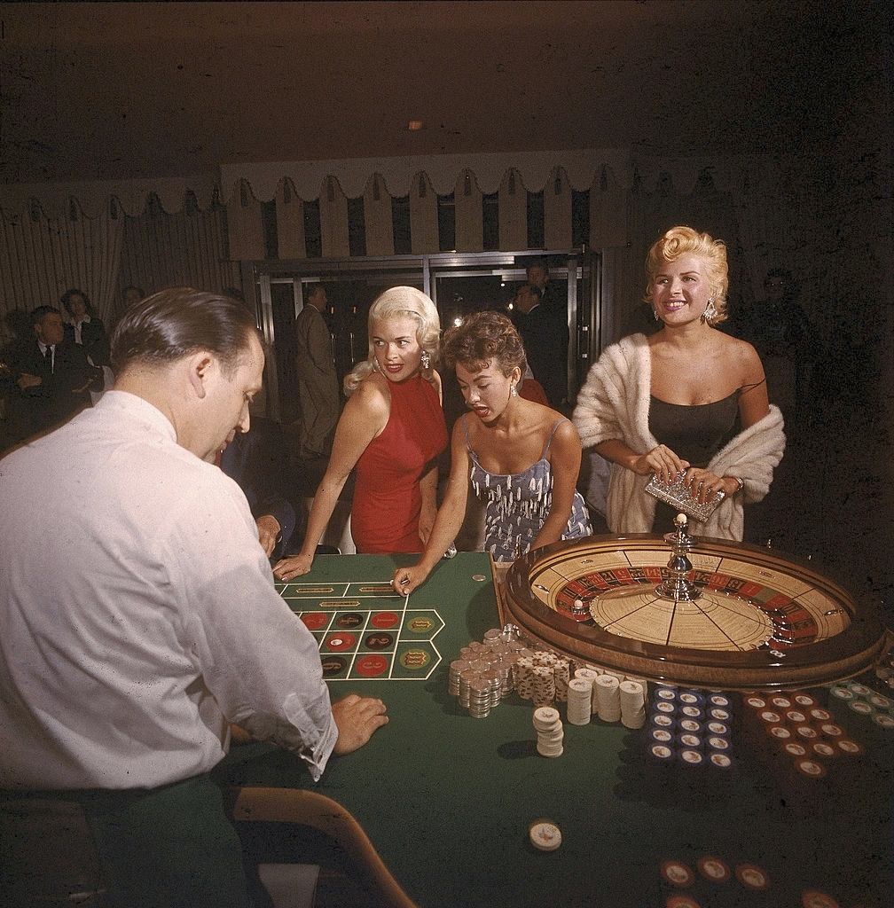 #6 Jayne Mansfield with Rita Moreno and Gloria Paul at the roulette table in the Dunes casino, Las Vegas, 1955