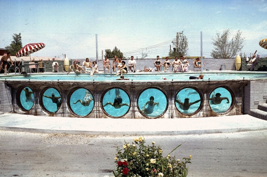 #15 Swimmers look through underwater portholes in a pool at an unidentified hotel, Las Vegas, 1955