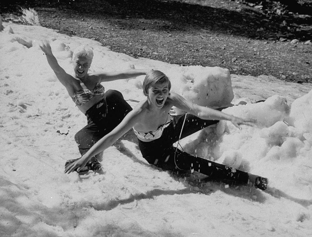 #51 Las Vegas Chorus Girl, Kim Smith playing in the snow with her friend, 1954.