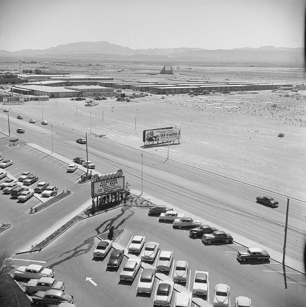 #53 Aerial view over the parking lot of the Rivera Hotel and surrounding desert, Las Vegas, Nevada, 1955.