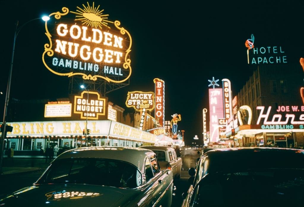 #11 General view of Downtown Las Vegas from Fremont Street looking at the Golden Nugget Gambling Hall, The Mint, Pioneer Club, Lucky Strike, The Las Vegas Club and The Hotel Apache circa 1958