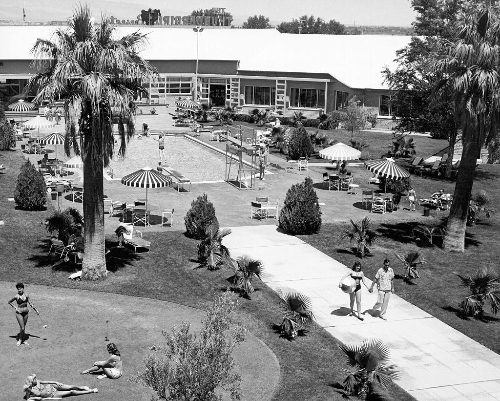 #65 The outdoor pool and patio scene at the Thunderbird Resort, Las Vegas, 1956.