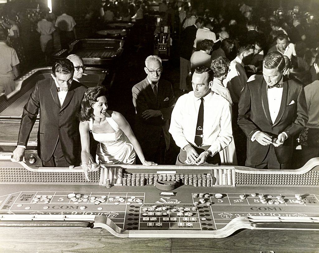 #1 A group stands at The Sands craps table, Las Vegas, 1959