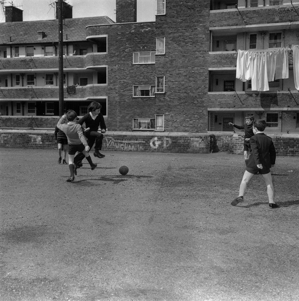 #29 A group of children playing football in Juvenal Gardens, Liverpool, 1971.
