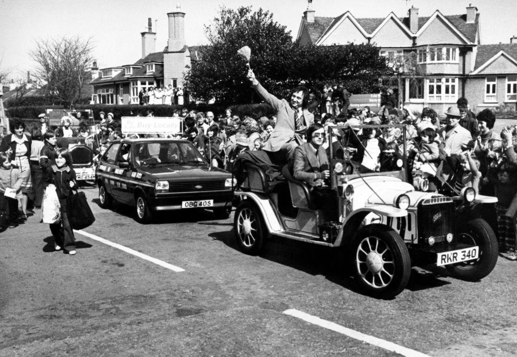 #41 Ken Dodd leads a parade in Hoylake in aid the Clatterbridge Hospital Cancer Research Trust, 6th April 1978.