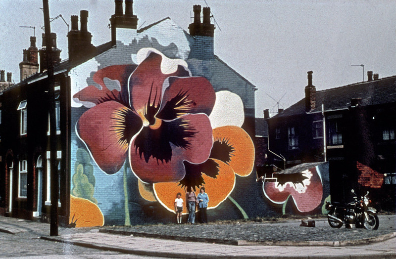 #8 Mural depicting pansies on the gable-end wall of terraced houses in Rochdale. Painted by Walter Kershaw in the early 1970s.