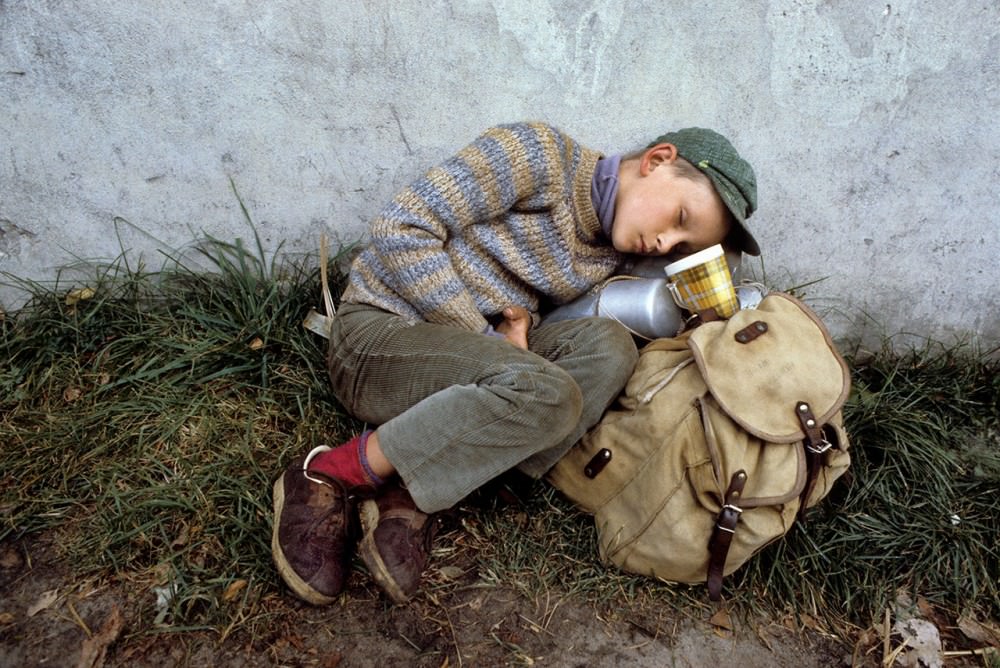 #28 Tired young boy during pilgrimage on foot Warsaw-Czestochowa, 1982.