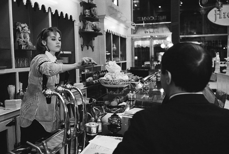 #7 Jane Fonda preparing a cup of ice-cream for a client at Hicks & Son.