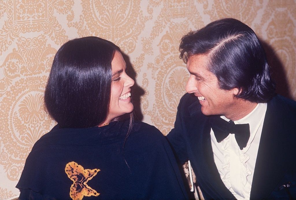 #26 Ali MacGraw with Robert Evans, 1970.