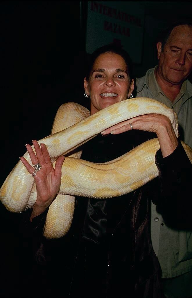 #48 Ali Mac Graw with a python, 1990.