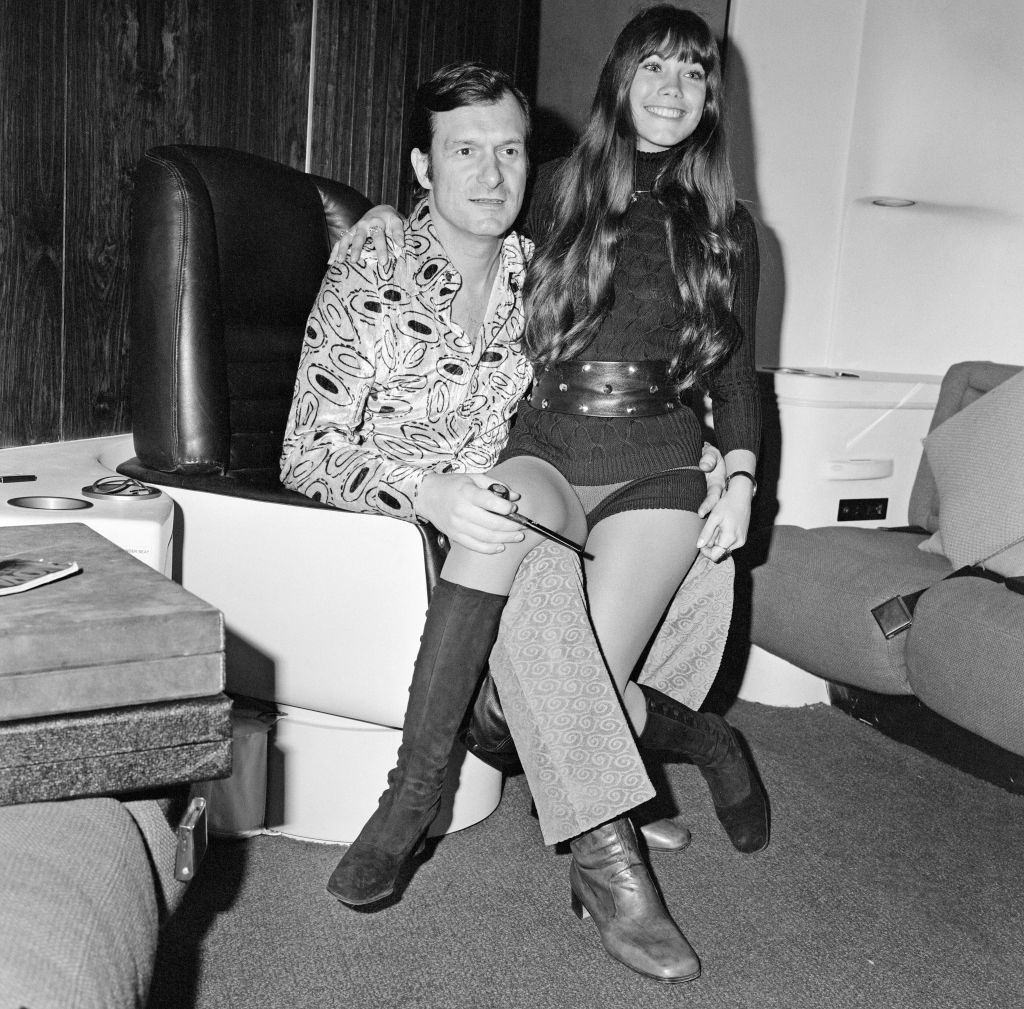 #27 Barbara Benton with Hugh Hefner in his private jet, 1971.