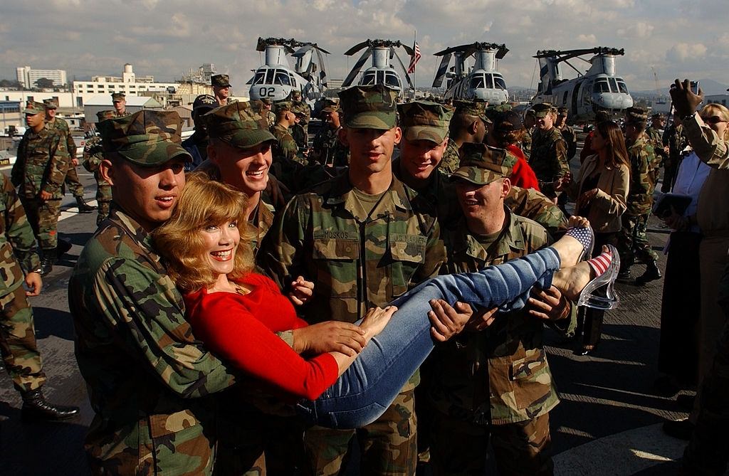 #53 Barbie Benton poses with Marines and Sailors aboard the USS Ogden November 30, 2001