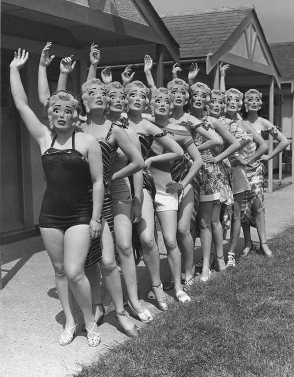 Women at Butlin’s holiday camp wear Marilyn Monroe face masks. Clacton-on-Sea, England, 1952.