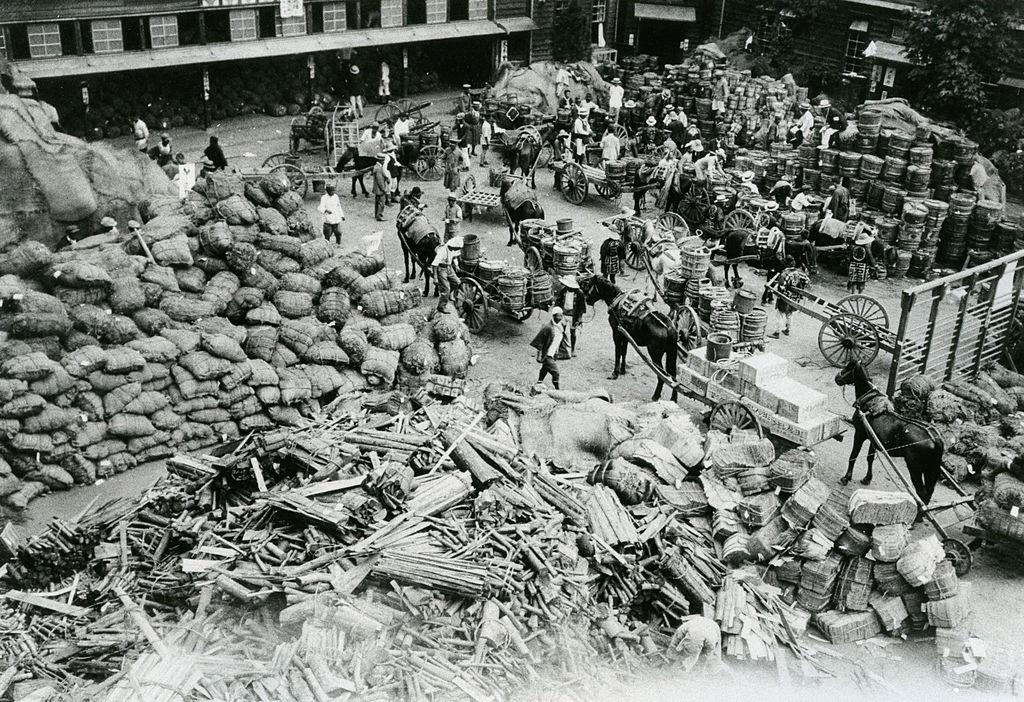 #24 Aid supply are collected at Ichigaya Elementary School after the Great Kanto Earthquake victims and debris float in Sumida River in September 1923.