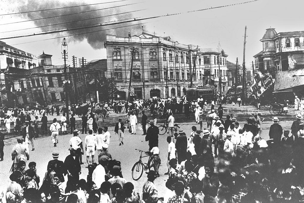 #29 People are stranded at Hibiya crossing as smoke arise from everywhere after the Great Kanto Earthquake.