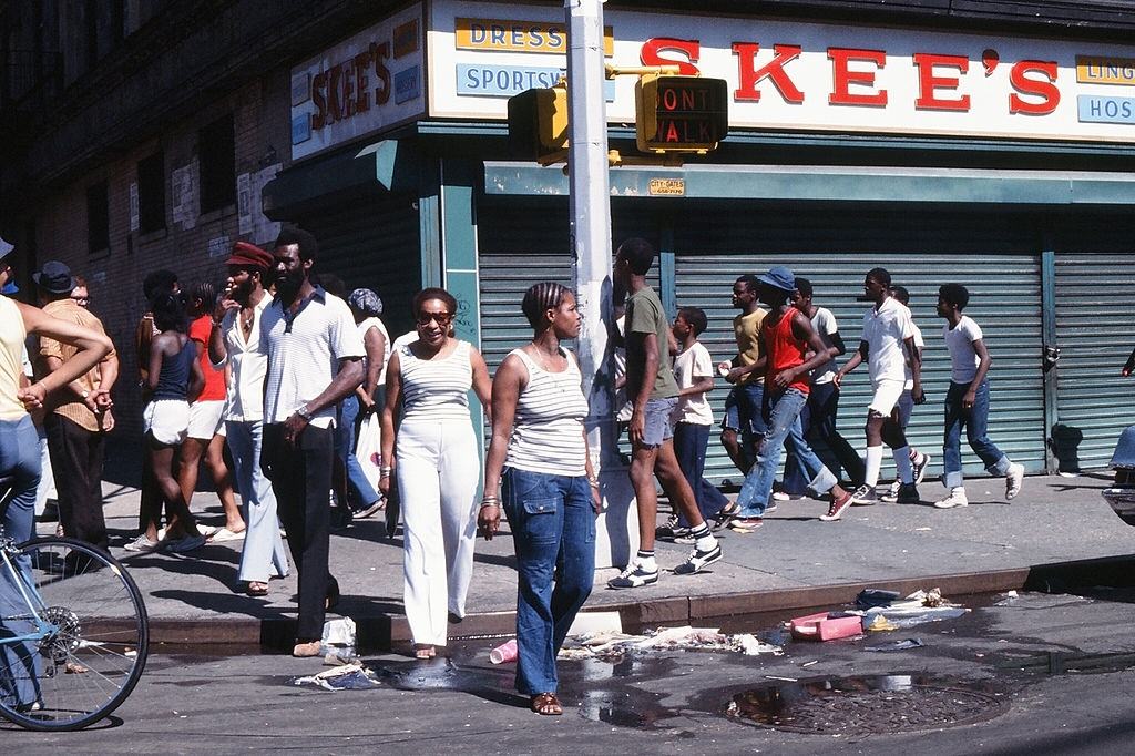 #40 Pedestrians stand on a street corner in the wake of the New York City blackout, Brooklyn, New York City, July 13, 1977.
