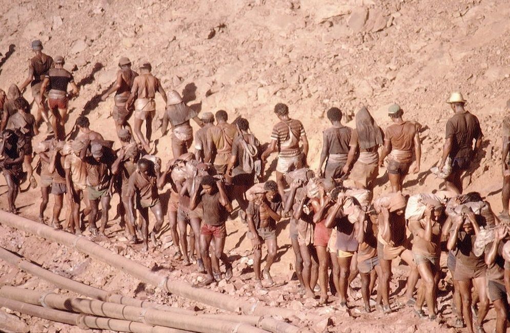 #7 Workers taking the raw material from gold mine.