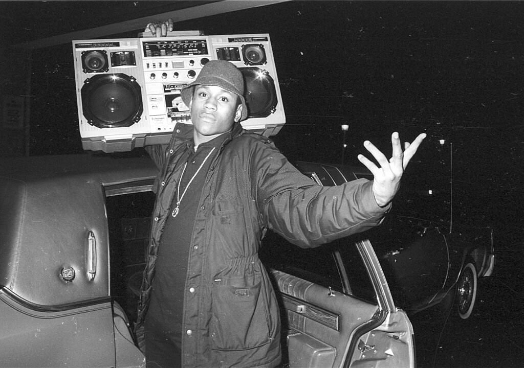 #14 LL Cool J holds a boombox outside a concert, circa 1986