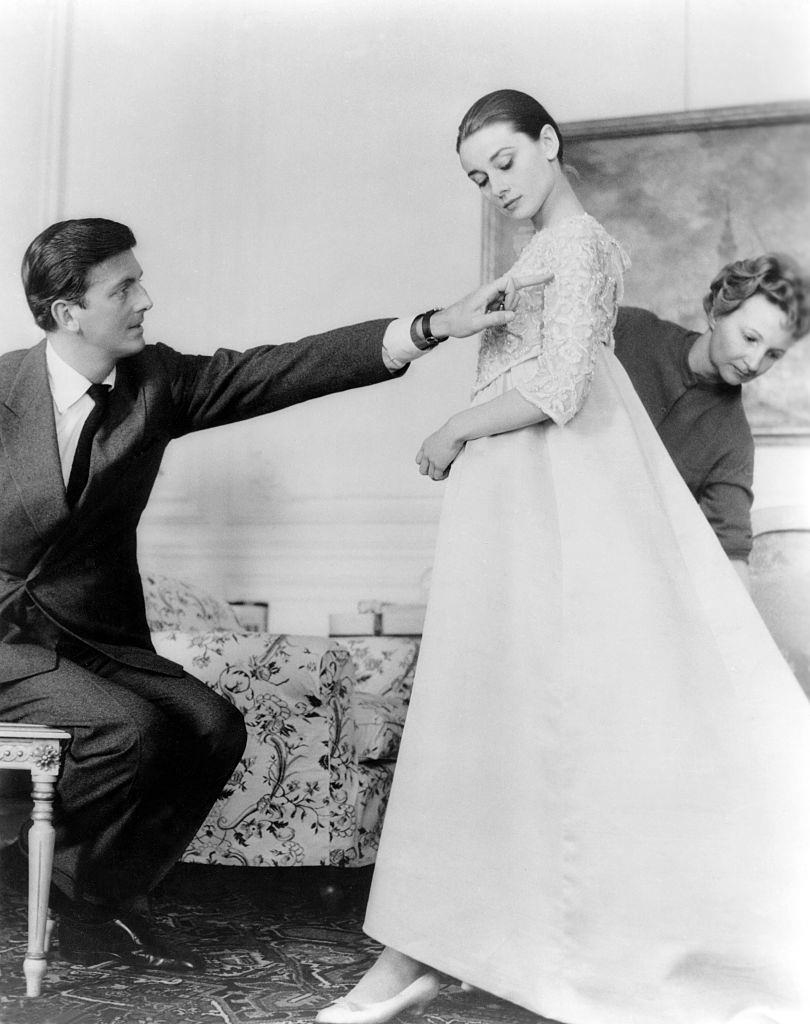 #25 Audrey Hepburn with French fashion designer Hubert de Givenchy in his workshop, in Paris.
