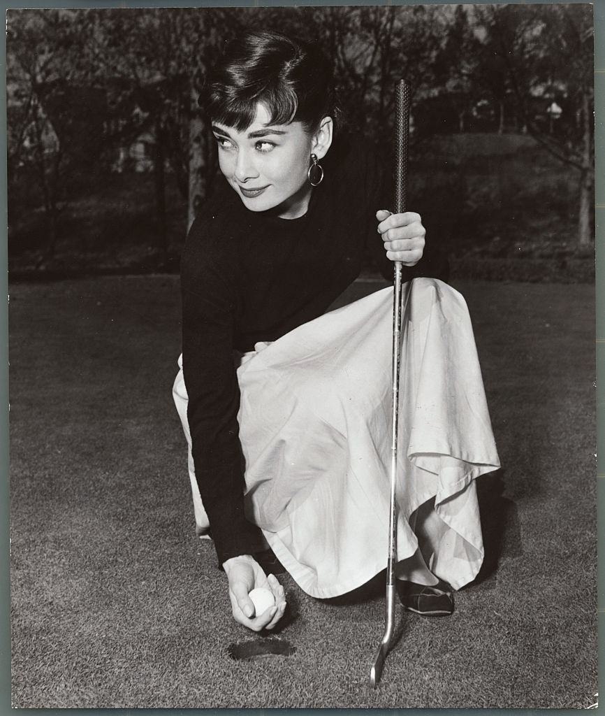 #41 Audrey smiles after a successful putt.