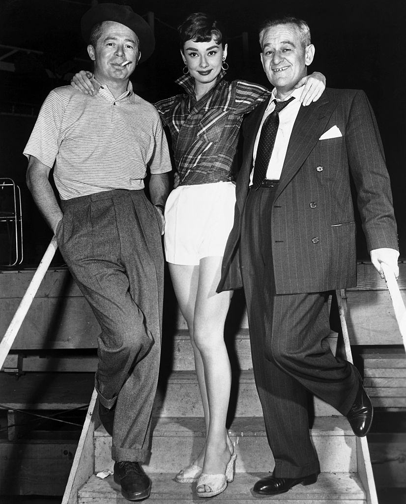 #51 Audrey Hepburn with Billy Wilder and William Wyler.