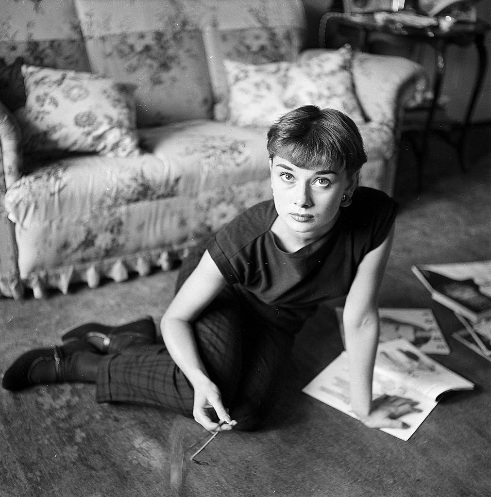 #64 Audrey Hepburn at her home in London, 1951.