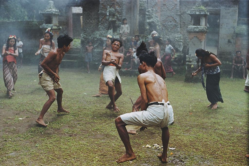 #19 Balinese men in a trance like state perform a ritual dance with knives, 1956.