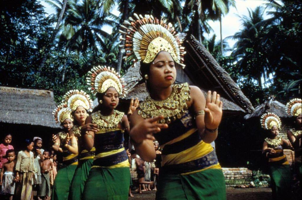 #22 Balinese ‘janger’ dancers in ceremonial costume with ornate headresses, 1956.