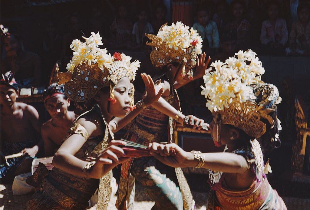 #24 Creamy white flowers decorate the ornate headresses of female dancers in Bali, 1956.