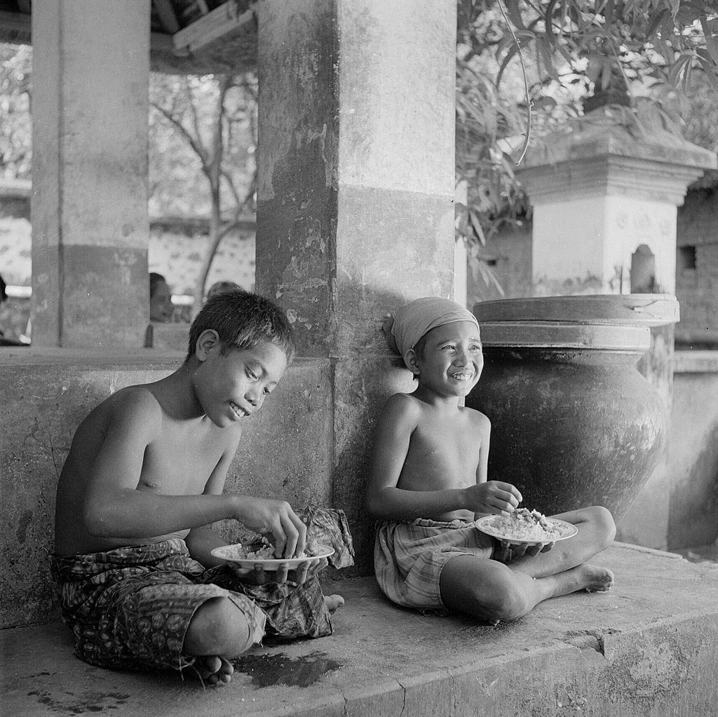 #11 A Balinese boy herding geese, 1955.