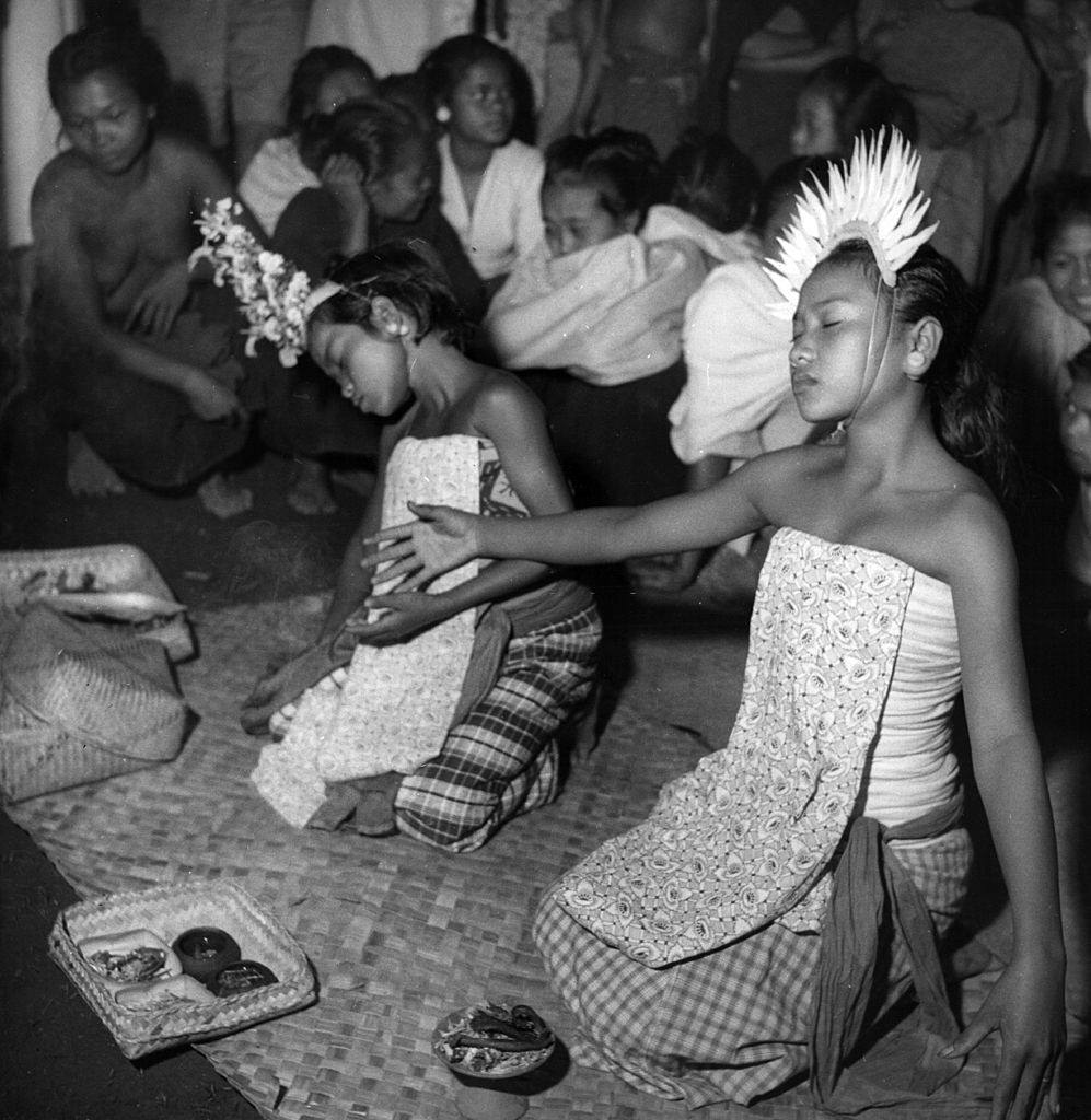 #30 Balinese traditional dancers sprinkle holy water over the singers and themselves and ask the goddesses to ‘go home, go home’, 1951.