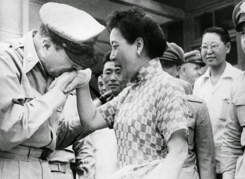 #39 Gen. Douglas MacArthur kisses the white-gloved hand of Madame Chiang Kai-shek on August 7, 1950