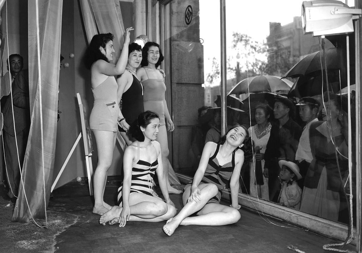 #53 To draw the public’s attention to a new line of bathing suits, a Tokyo department store used live models to show off the suits on June 5, 1950.