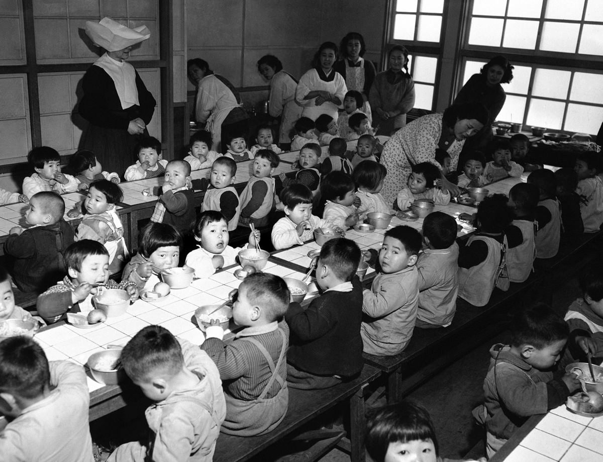 #4 Dining room of an orphanage in Osaka, Japan, on February 19, 1951, where the 160 orphans were fed each day on food purchased by the Wolfhounds, the 27th Infantry Regiment of the U.S. Army.